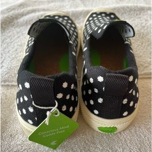 Black and white Cariuma slip on shoes. New - never worn.